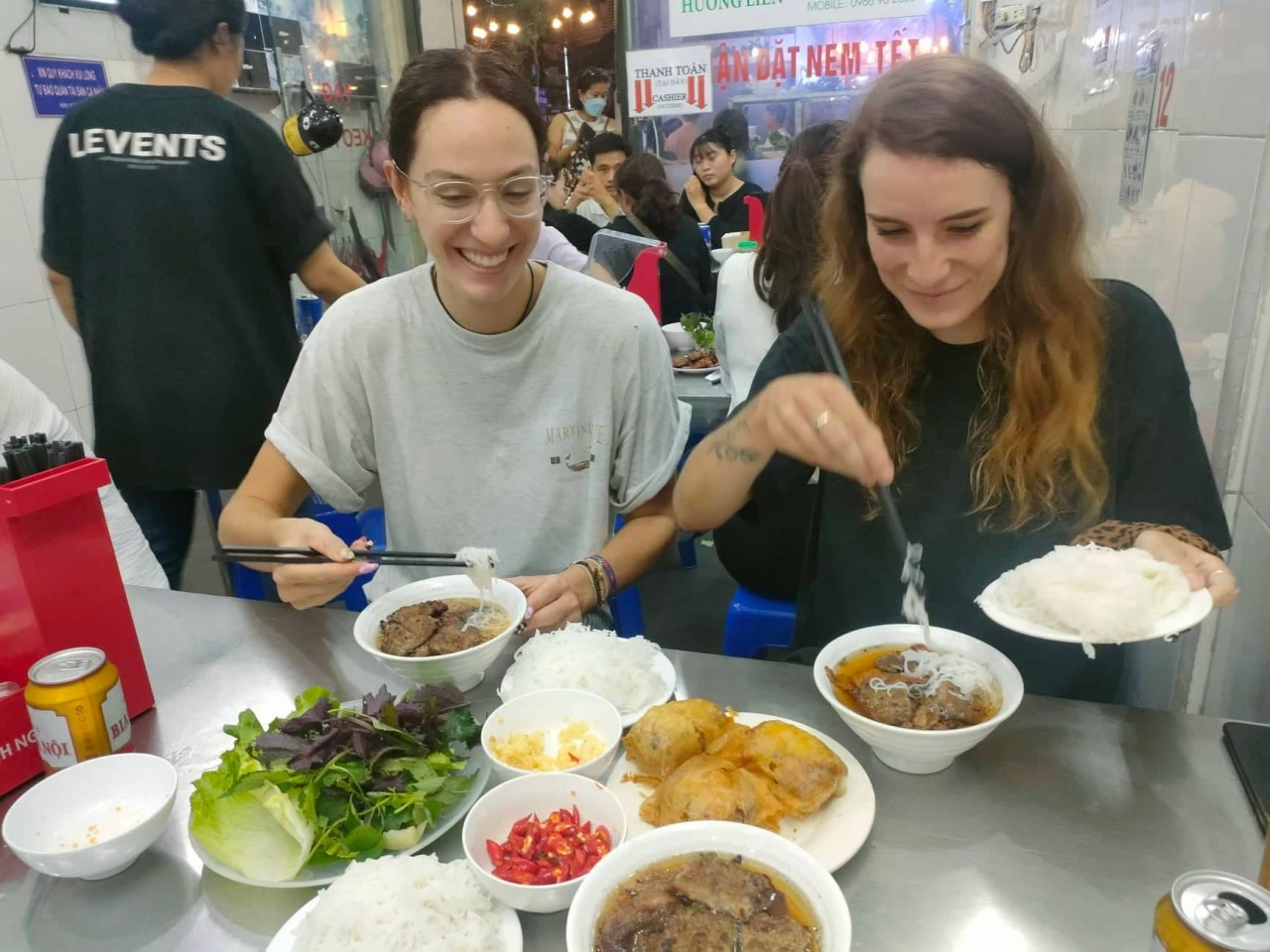 Oceane and Elsa digging in at the packed tourist locale (Photo: Jason Law)