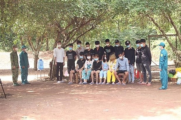 People illegally exiting Cambodia at a border post. Photo: VNA broadcast