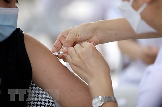 Getting vaccinated against Covid-19. Photo: VNA