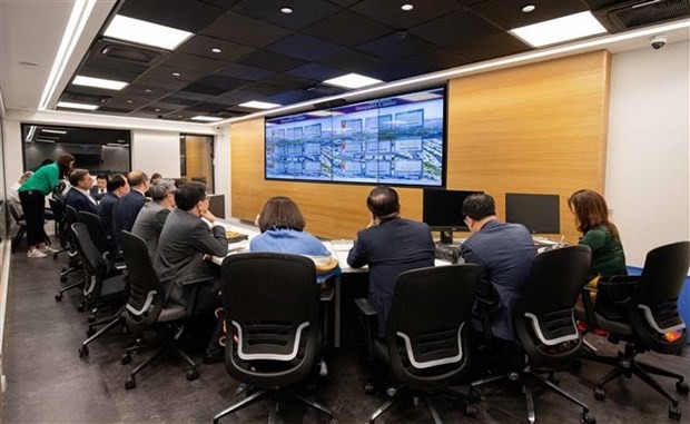 The delegation learns about urban management in Modi'in city. Photo: VNA
