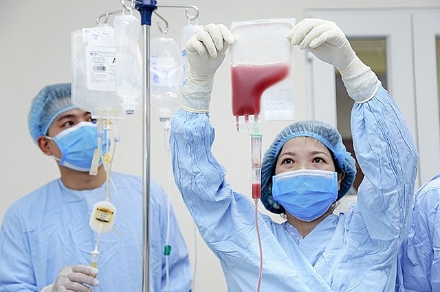 Blood research scientists at the National Institute of Hematology and Blood Transfusion in Hà Nội.  Photo Cong Thang