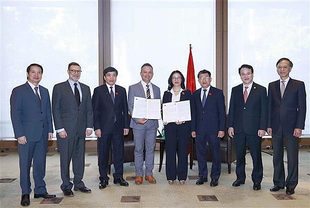 At the signing ceremony. Photo: VNA