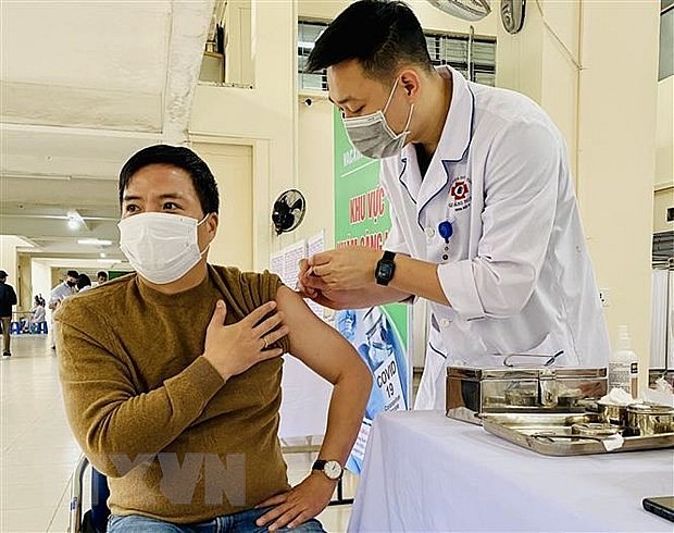A man gets vaccinated against Covid-19. Photo: VNA