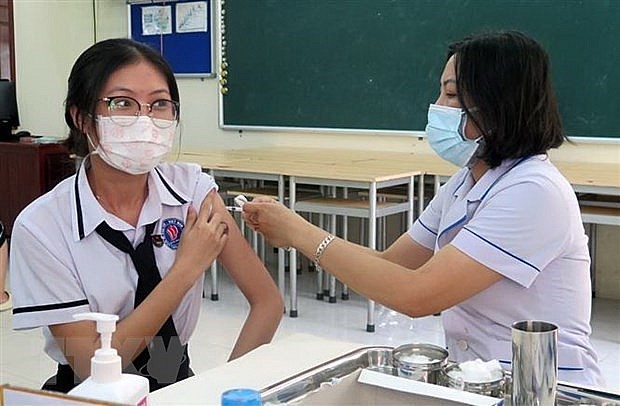 the total number of doses of COVID-19 vaccines injected rises to 265,519,661. Photo: VNA)