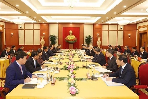 At the high-level meeting between the two Parties. Photo: VNA