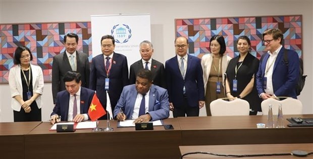 At the signing ceremony of the agreement. Photo: VNA