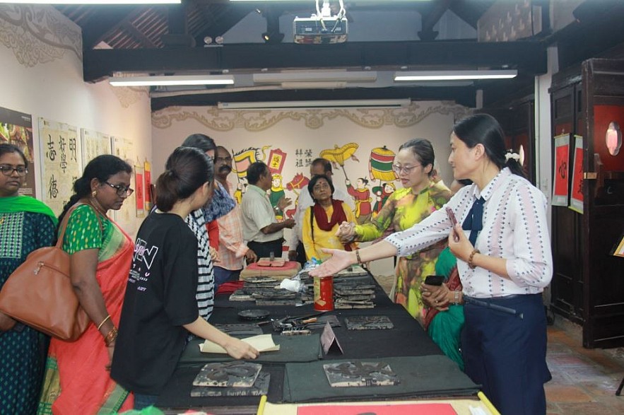 Indian Friends Visit Quoc Tu Giam, Try Woodblock Printing