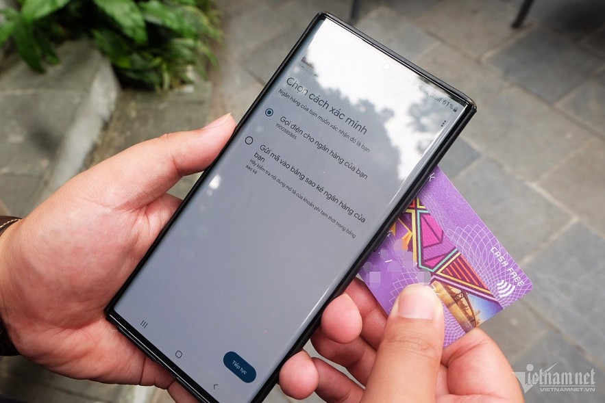 A user integrates a payment card into a digital wallet on a mobile application. Photo: Trong Dat
