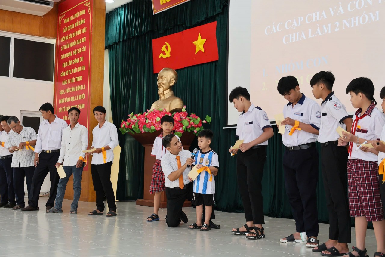 participants engaged in interactive games designed to educate men and father-son pairs about various forms of violence against women and children