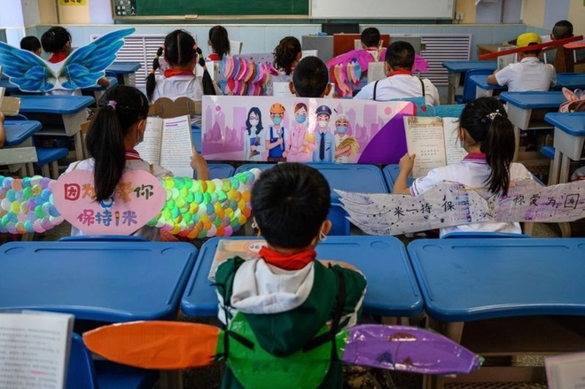 chinese students wear adorable social distancing wings at school