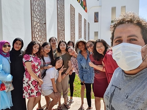 Cam hoa (second, from right) with other international members in her project