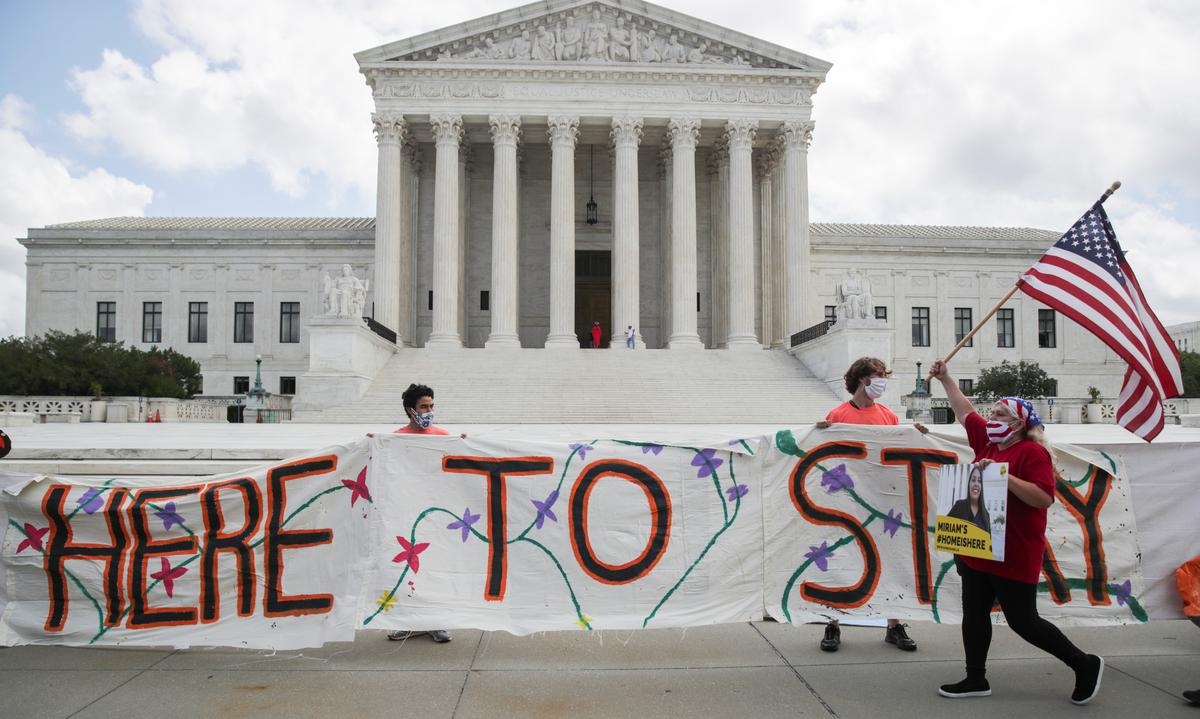 DACA recipients and their supporters celebrate outside the U.S. Supreme Court