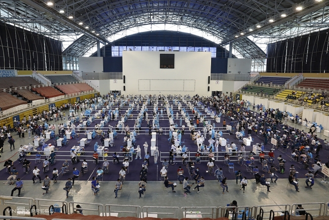 Ho Chi Minh City reports record 1 day increase in Covid cases, Hanoi eases preventive measures
