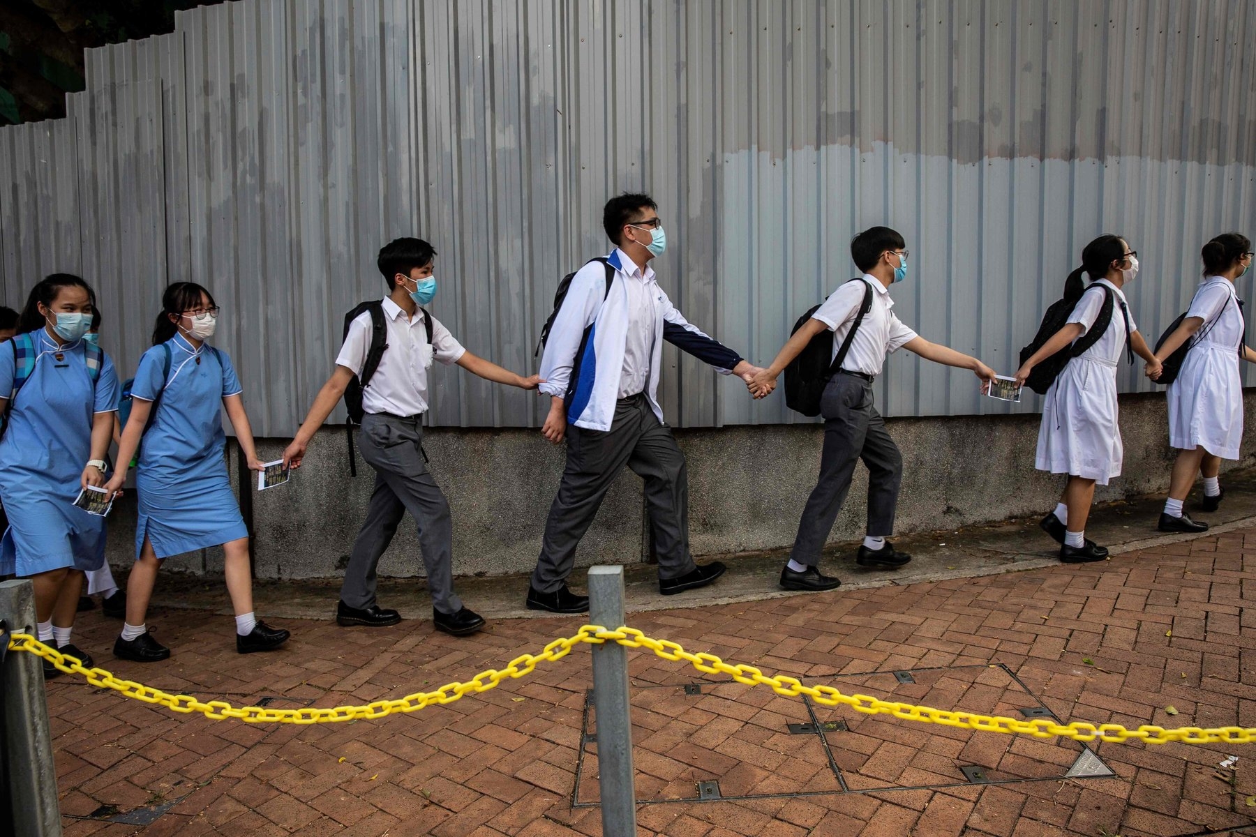 Hong Kong students are banned from singing the protest anthem “Glory to Hong Kong,” posting slogans with political messages or forming human chains