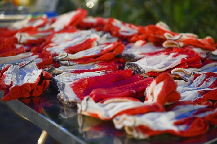 Protective gloves are readily available for volunteers to use