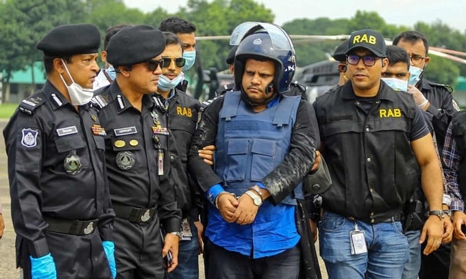 Mohammad Shahed escorted by police