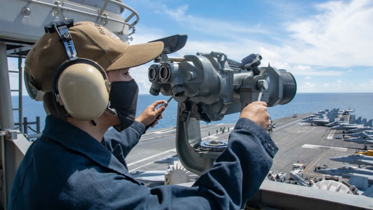 Seaman alexander chitty stands forward lookout watch on the signal bridge of navy’s only forward-deployed aircraft carrier uss ronald reagan in bien dong sea