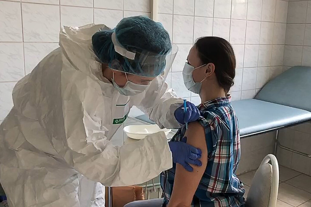 A volunteer receives the vaccine developed by the Gamaleya Institute as part of clinical trials 