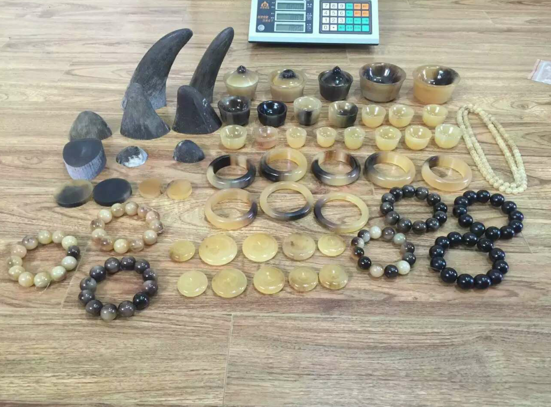 An undercover photograph of raw and carved rhino horn for sale in vietnam.