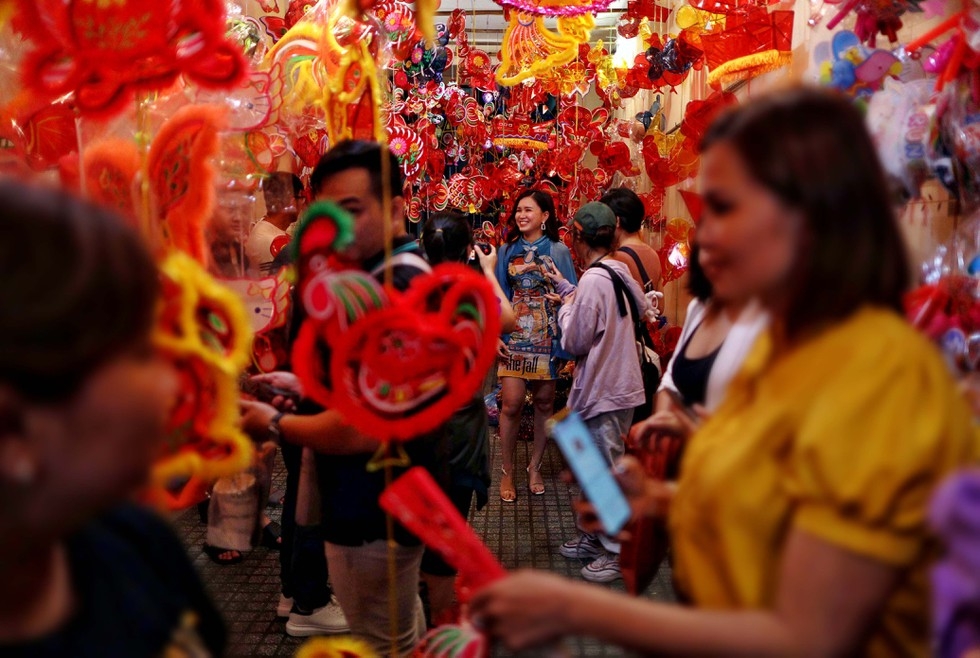 Lantern street in Saigon jam-packed with holiday goers