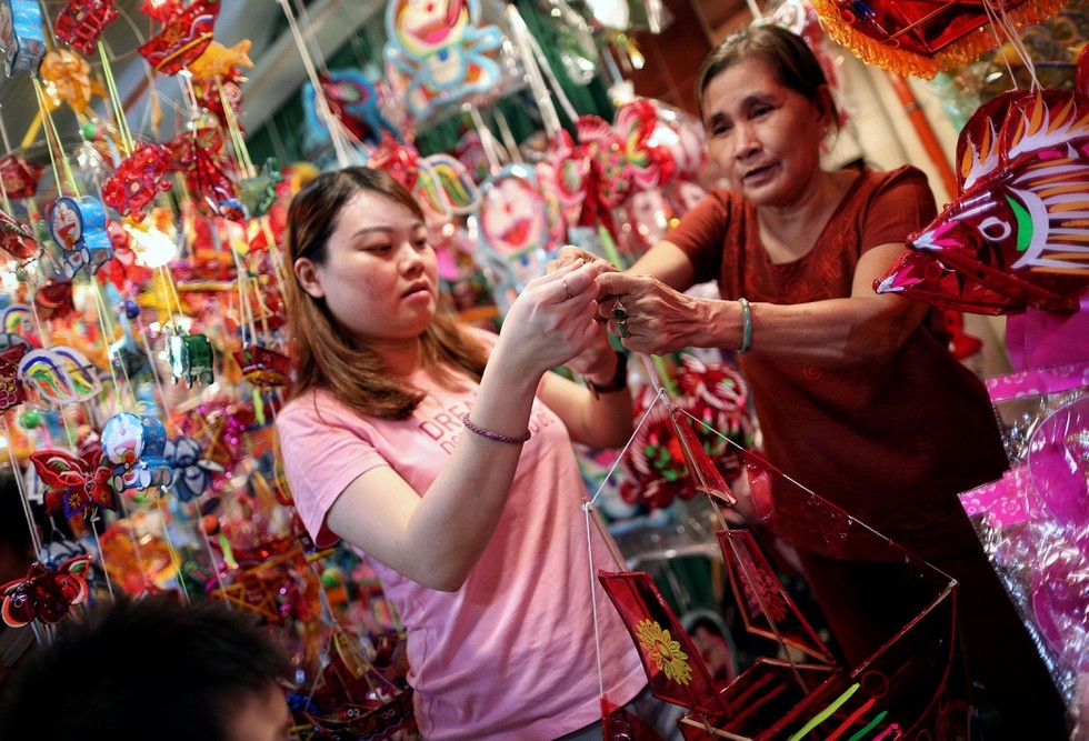 Lantern street in Saigon jam-packed with holiday goers