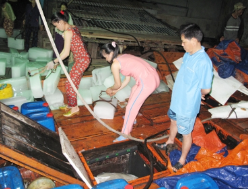 Wives of the fishermen preparing for the long journey before sailing  