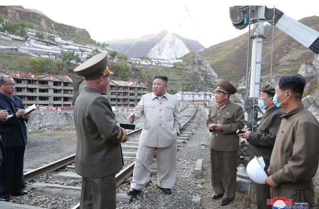 North korean leader kim jong un promised to help typhoon-hit areas recover and build at least 25,000 houses