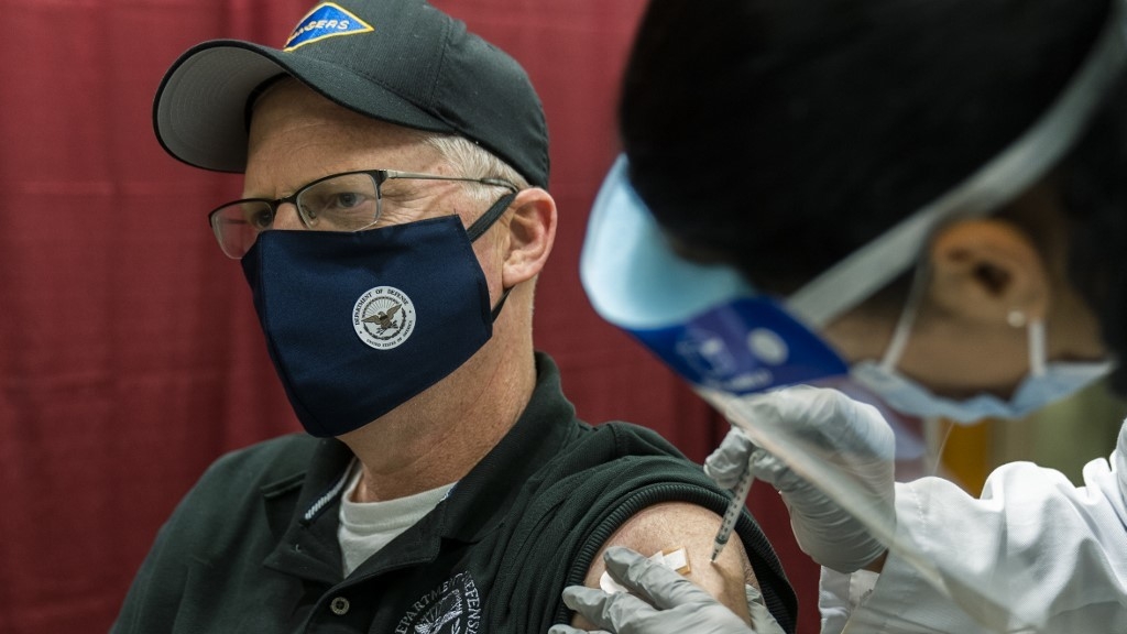 Pentagon chief christopher miller receiving the jab (photo: rappler) 