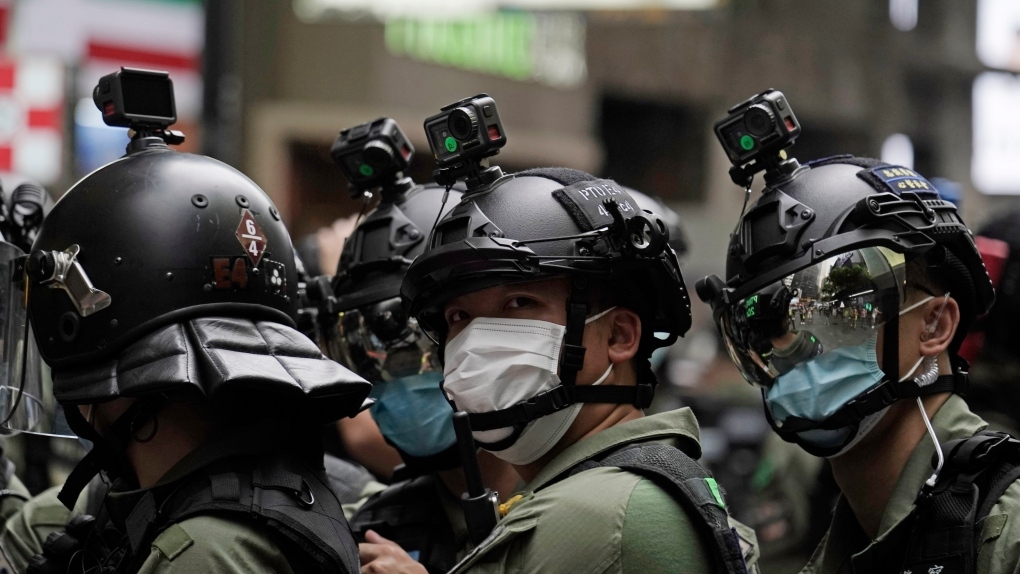 Cameras are installed in the helmets of riot police on China's National Day in Causeway Bay, Hong Kong, on Thursday, Oct. 1, 2020. 