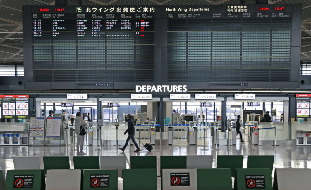 japan to halt new entry of foreign nationals over new virus strain