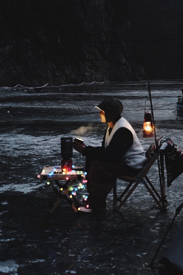 Vietnamese tourists camp on frozen river