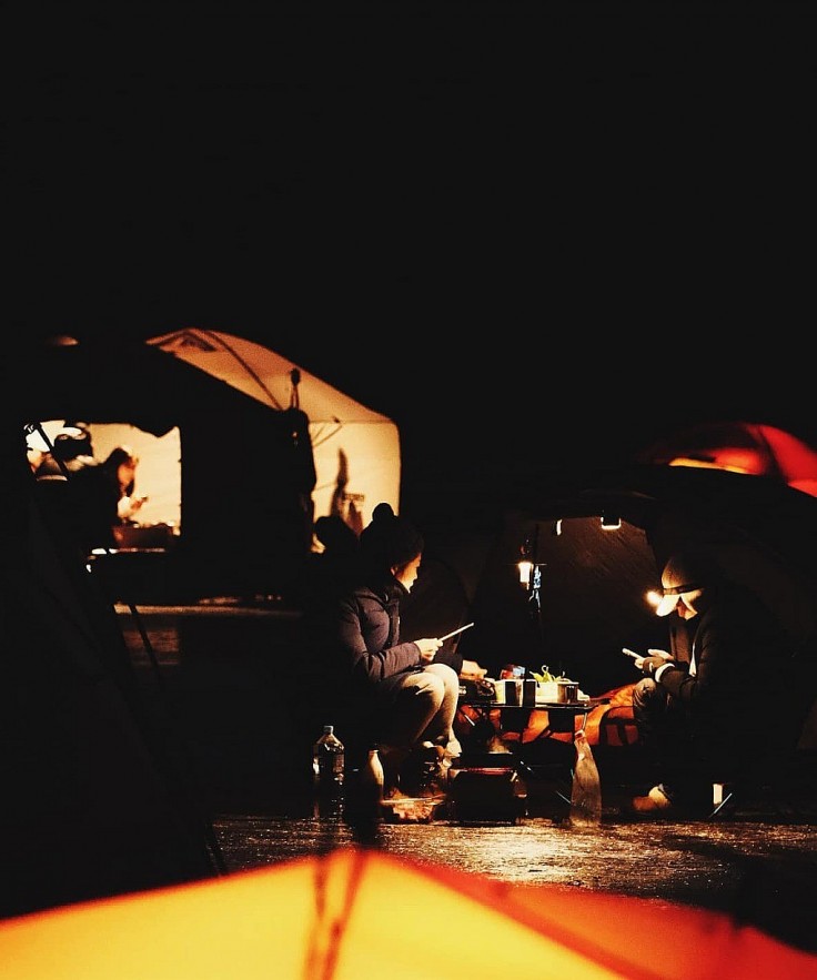 Vietnamese tourists camp on frozen river