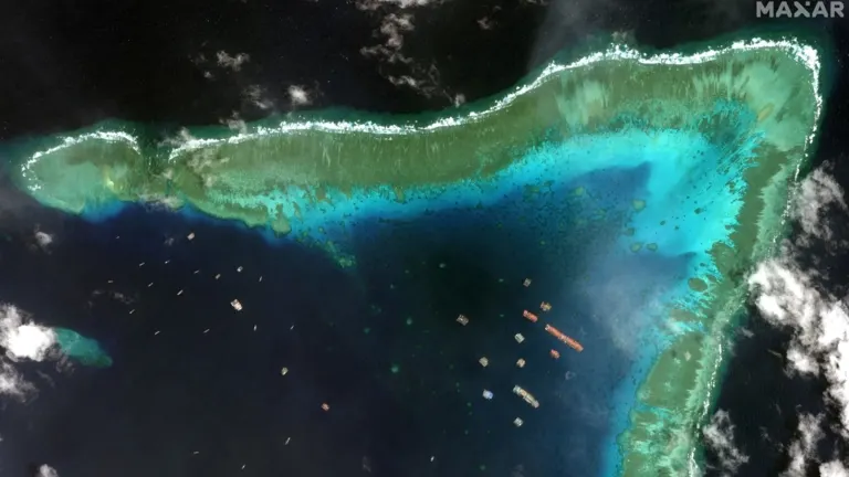 Satellite view of fishing vessels in the Whitsun Reef, which Manila calls the Julian Felipe Reef, in this Maxar image taken March 23.   © Reuters