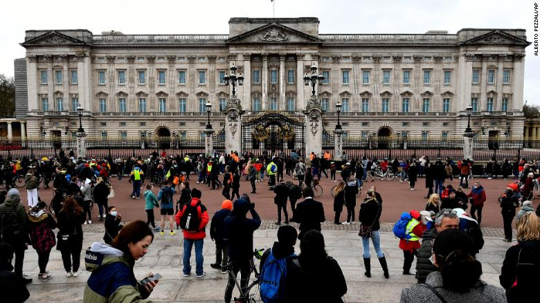 People gather outside the gates of Buckingham Palace in London on Saturday. (Photo: CNN) 