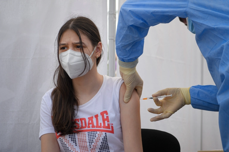The Pfizer-BioNTech vaccine has already been approved for adolescents in the EU [Andreea Alexandru/AP Photo]