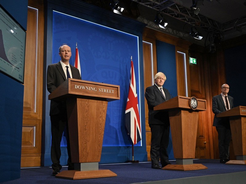 Chris Whitty, chief medical adviser to the UK government, in a 12 July press conference with Prime Minister Boris Johnson (centre) and chief scientific adviser Patrick Vallance (right).Credit: Daniel Leal-Olivas/AFP/Getty