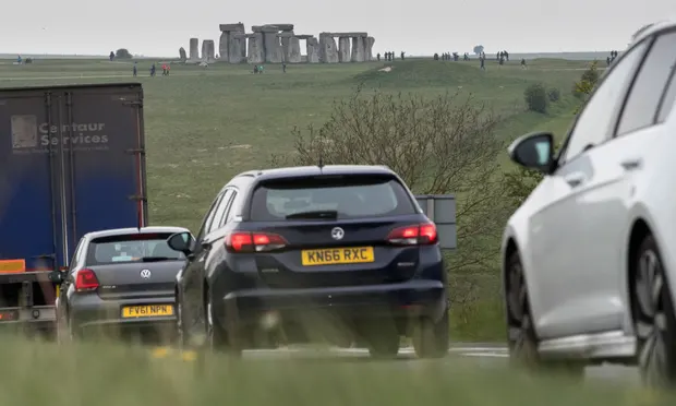 Traffic on the A303 that runs beside the ancient monument. Photograph: Matt Cardy/Getty Images