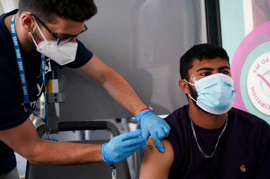 Experts say the vaccine rollout has greatly helped curb the virus – but it has not yet been beaten (Picture: PA)