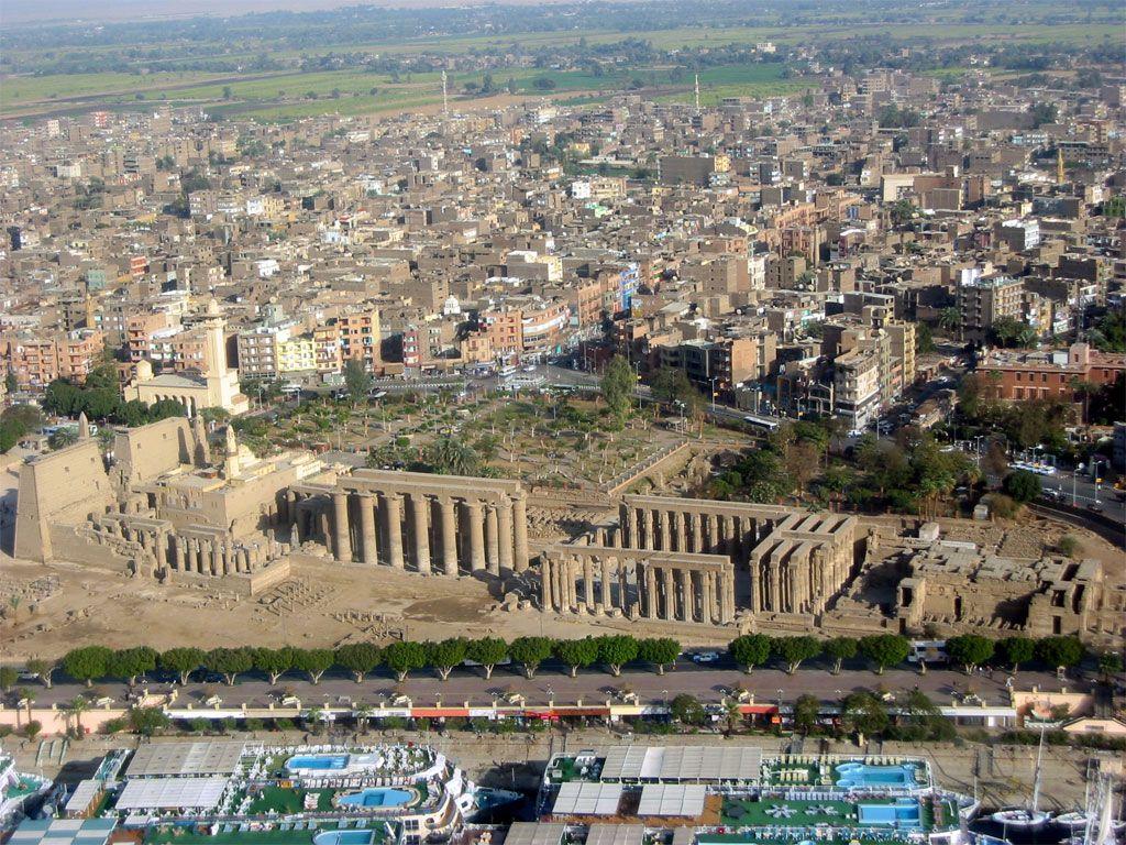 Ruins of ancient Luxor, surrounded by the modern-day city, Source: Pinterest