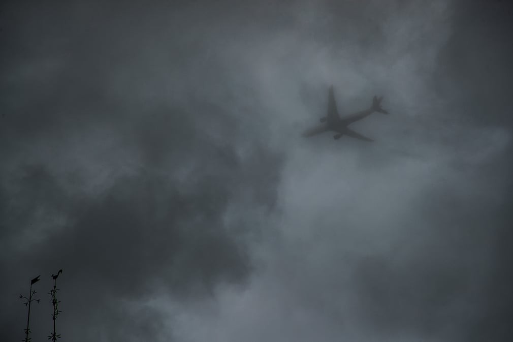 A plane flies over the Vieux Pays in Goussainville. Christophe Petit-Tesson/EPA