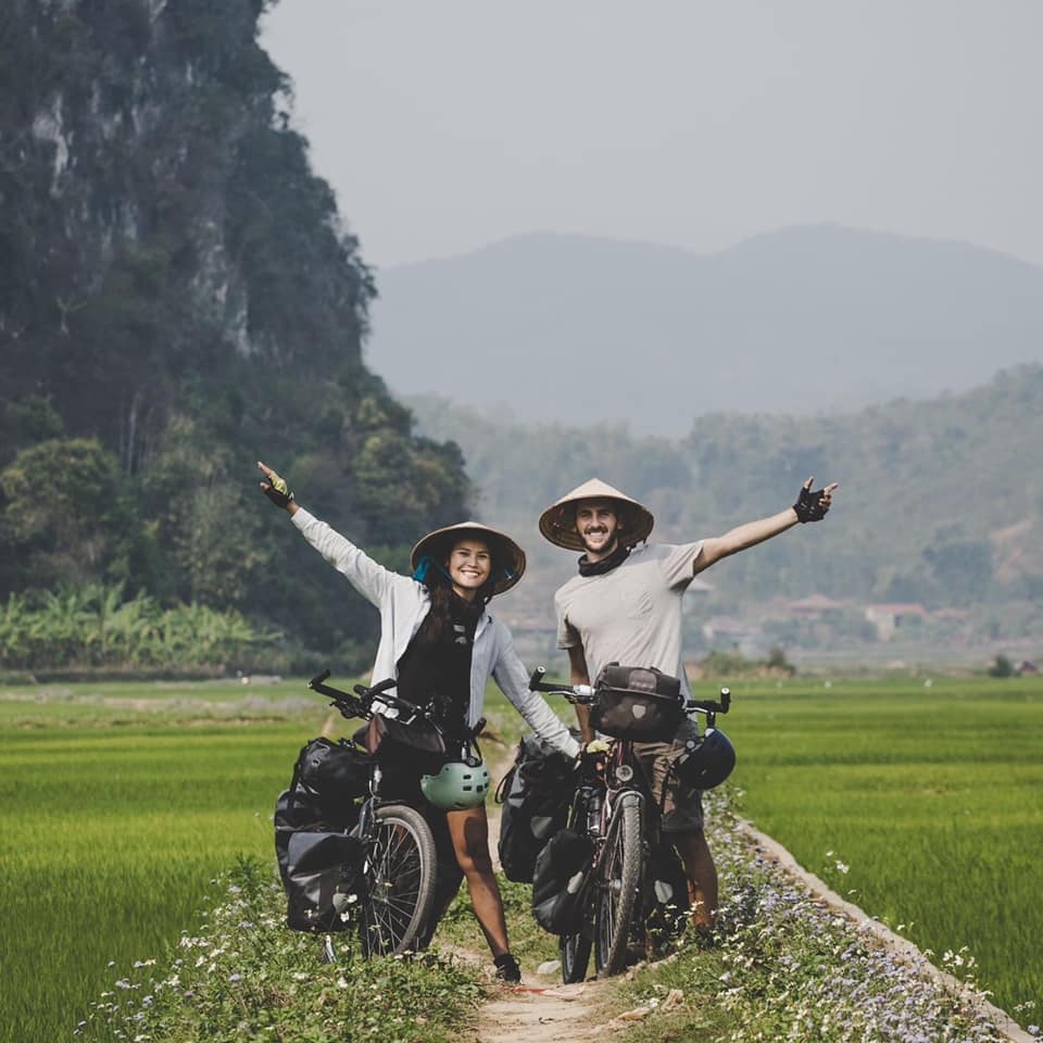 vietnamese french couple cycles from europe to asia for needy children