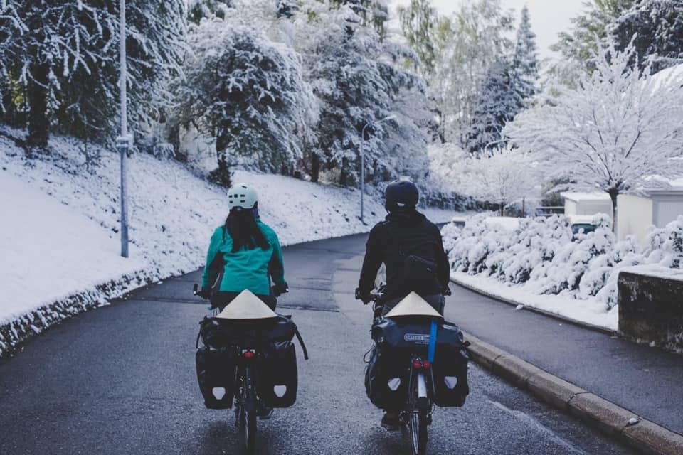vietnamese french couple cycles from europe to asia for needy children