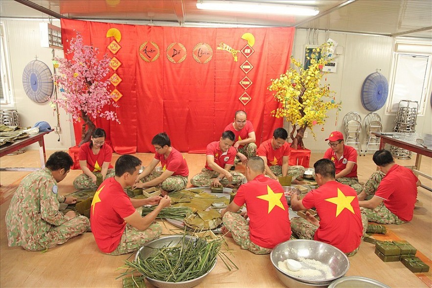 Banh Chung (glutinous rice cake) which is indispensable during Tet is wrapped with banana leaves taken from capital Juba, and pork from pigs raised by the Vietnamese officers and employees locally.