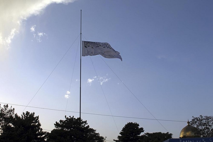 The Taliban flag flies at the Ghazni provincial governor's house, in Ghazni, southeastern, Afghanistan, Sunday, Aug. 15, 2021. (AP Photo/Gulabuddin Amiri)
