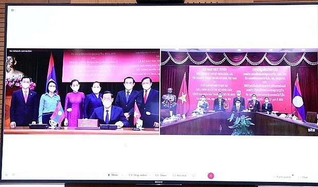 Vietnam, Laos Share Party Building Experience