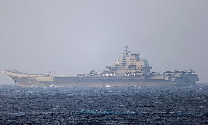 Chinese aircraft carrier Liaoning sails through the Miyako Strait near Okinawa on its way to the Pacific in this handout photo taken by Japan Self-Defense Forces and released by the Joint Staff Office of the Defense Ministry of Japan on April 4, 2021. Photo handout via Reuters