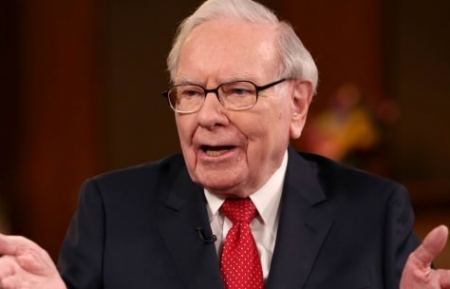 Warren Buffett: 'Bet on America,' buying stocks