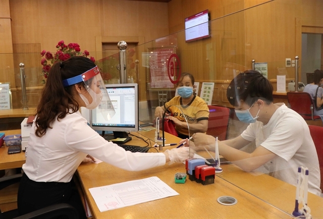 vietnam central bank reduces rates to aid post pandemic recovery