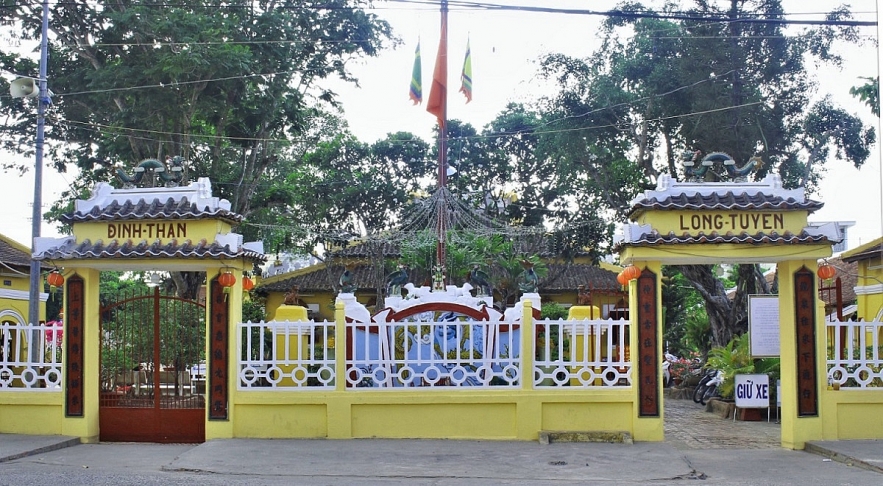 Admiring two century-old communal house in Mekong Delta