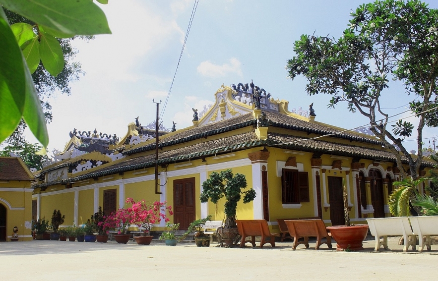Admiring two century-old communal house in Mekong Delta